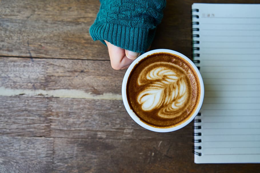 Person Holding Cup of Coffee Beside Notebook, brown, caffeine HD wallpaper