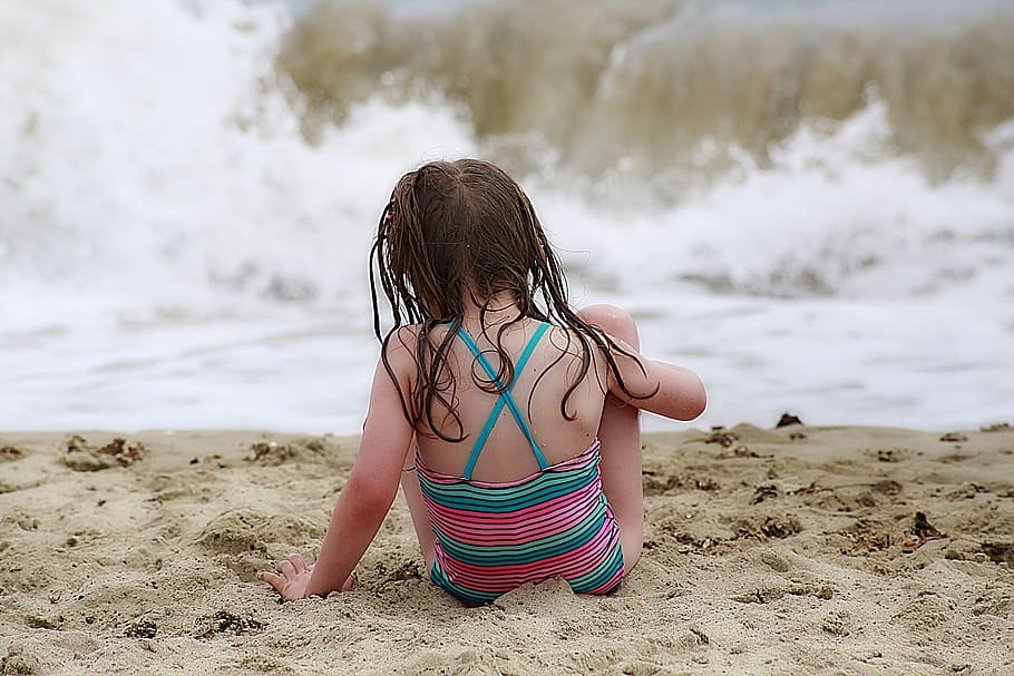 Girl Wearing Colorful Halter Top Swim Wear Sitting on a Brown Sand HD wallpaper