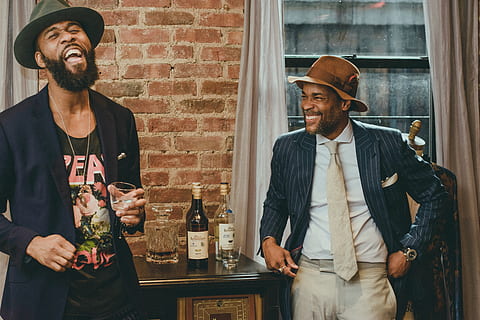 Smiling Men Inside Room, beard, bottles, brick wall, cap, casual HD wallpaper