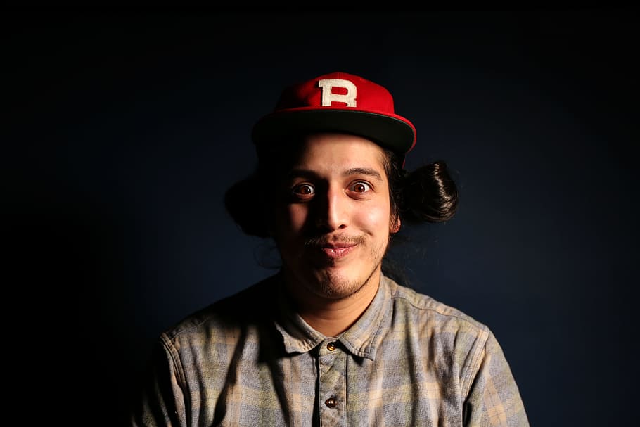 Man Wearing Red Fitted Cap and Brown and Gray Plaid Collared Hsirt HD wallpaper