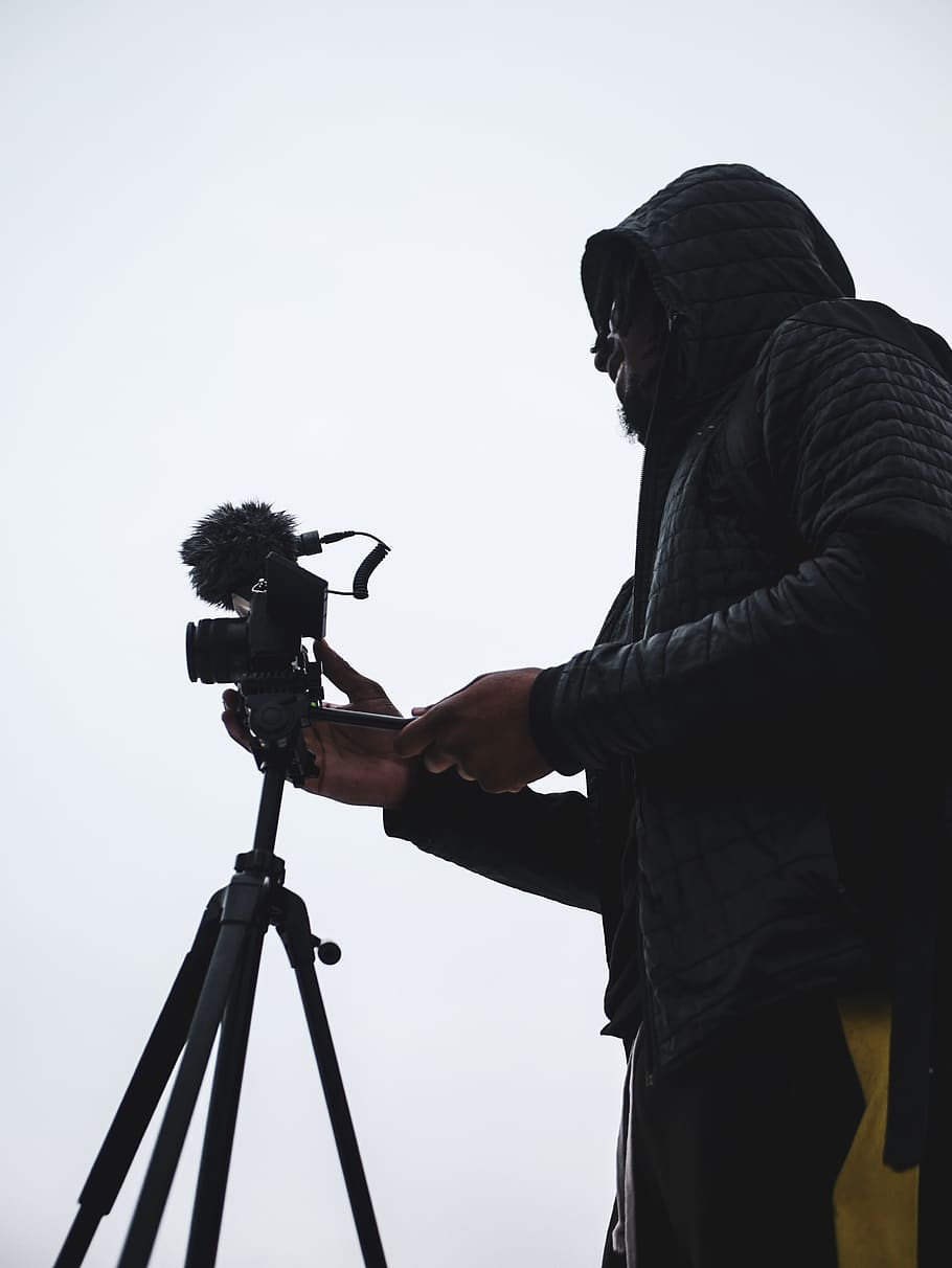 Person Holding Camera on Tripod, close-up, daylight, equipment HD wallpaper