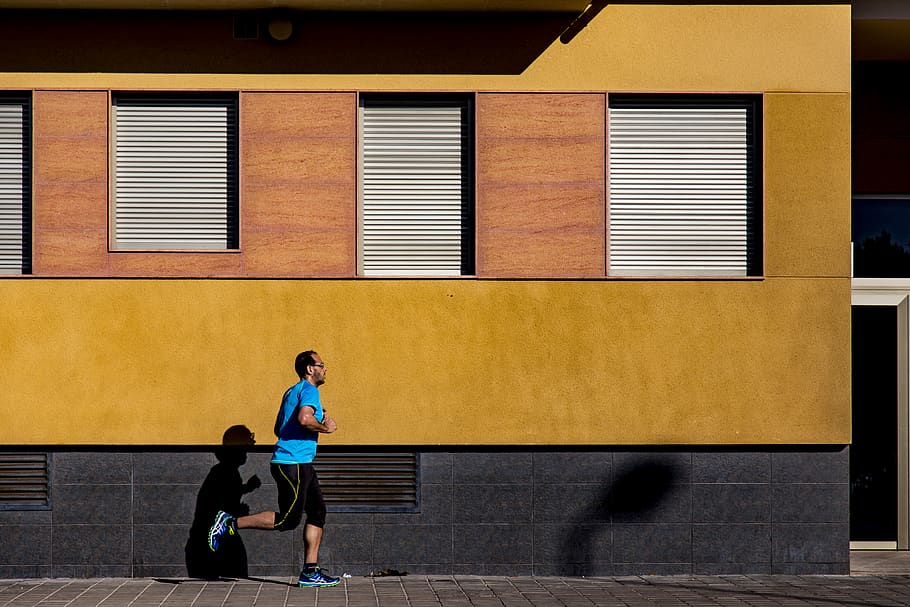 Jogging Man Wearing Blue Shirt during Daytime, person, shadow HD wallpaper