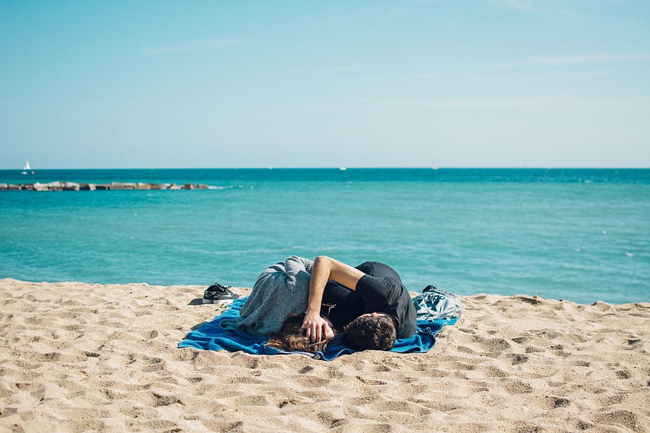 Man and Woman Lying on Blue Textile at Seashore, beach, blanket HD wallpaper