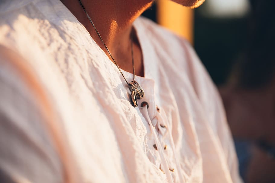 A young Caucasian man wearing ring in a neckchain at sunset, 20-25 year old, HD wallpaper