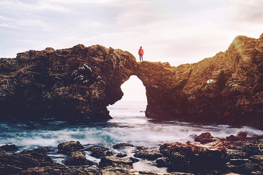 man on cliff, rock, water, rock - object, solid, sky, sea, beauty in nature HD wallpaper