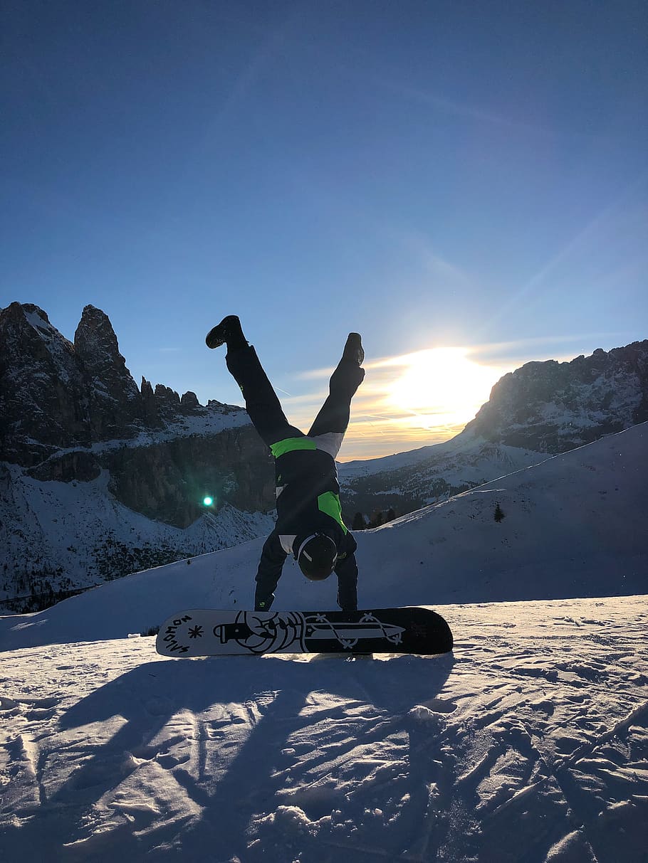 Photo of Person Doing Handstand Near Snowboard, action, cold HD wallpaper