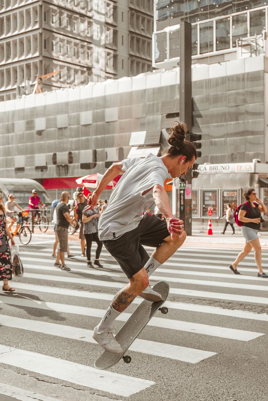 Photo of Man Riding Skateboard on Pedestrian, action, adult, crossing