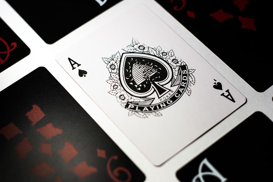 spade-playing-card-on-white-surface.jpg