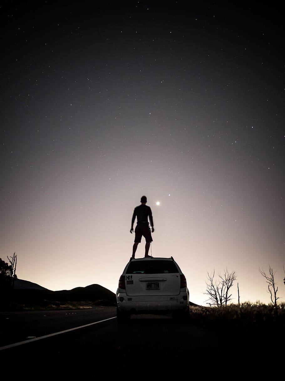 man standing on SUV, sky, star - space, men, nature, mode of transportation HD wallpaper