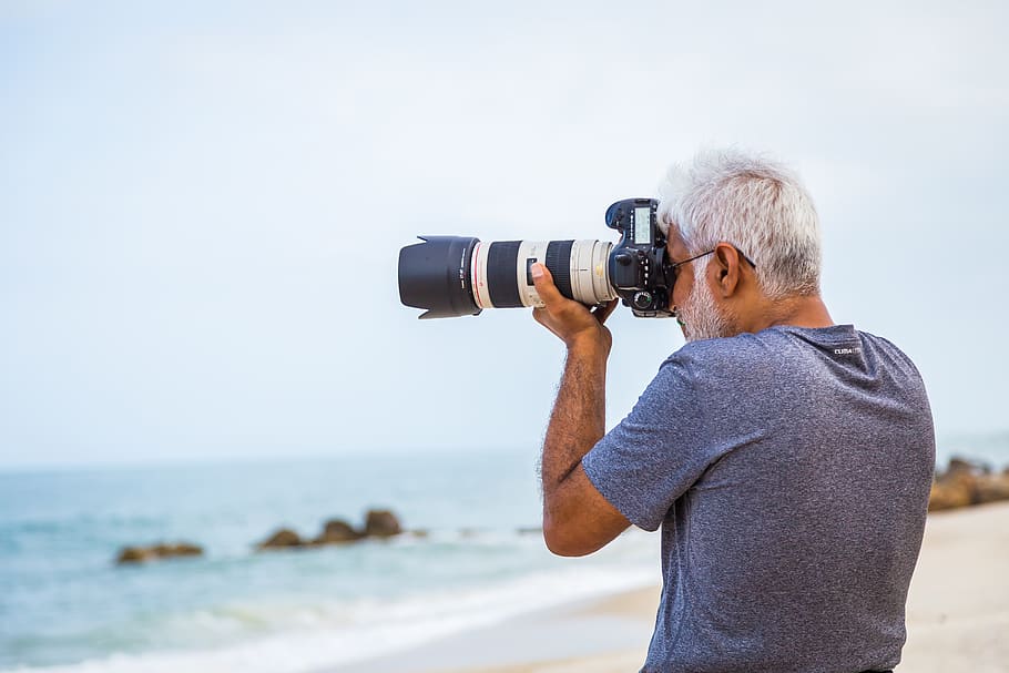 Man Taking Photo of Sea, beach, camera, camera lens, daylight HD wallpaper