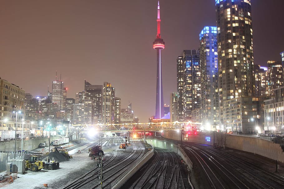 Train Tracks at night near CN Tower and skyscrapers in Toronto, Canada