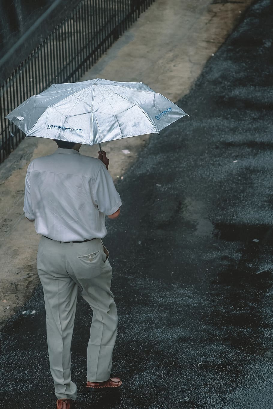 man holding umbrella, human, person, canopy, jakarta, indonesia HD wallpaper