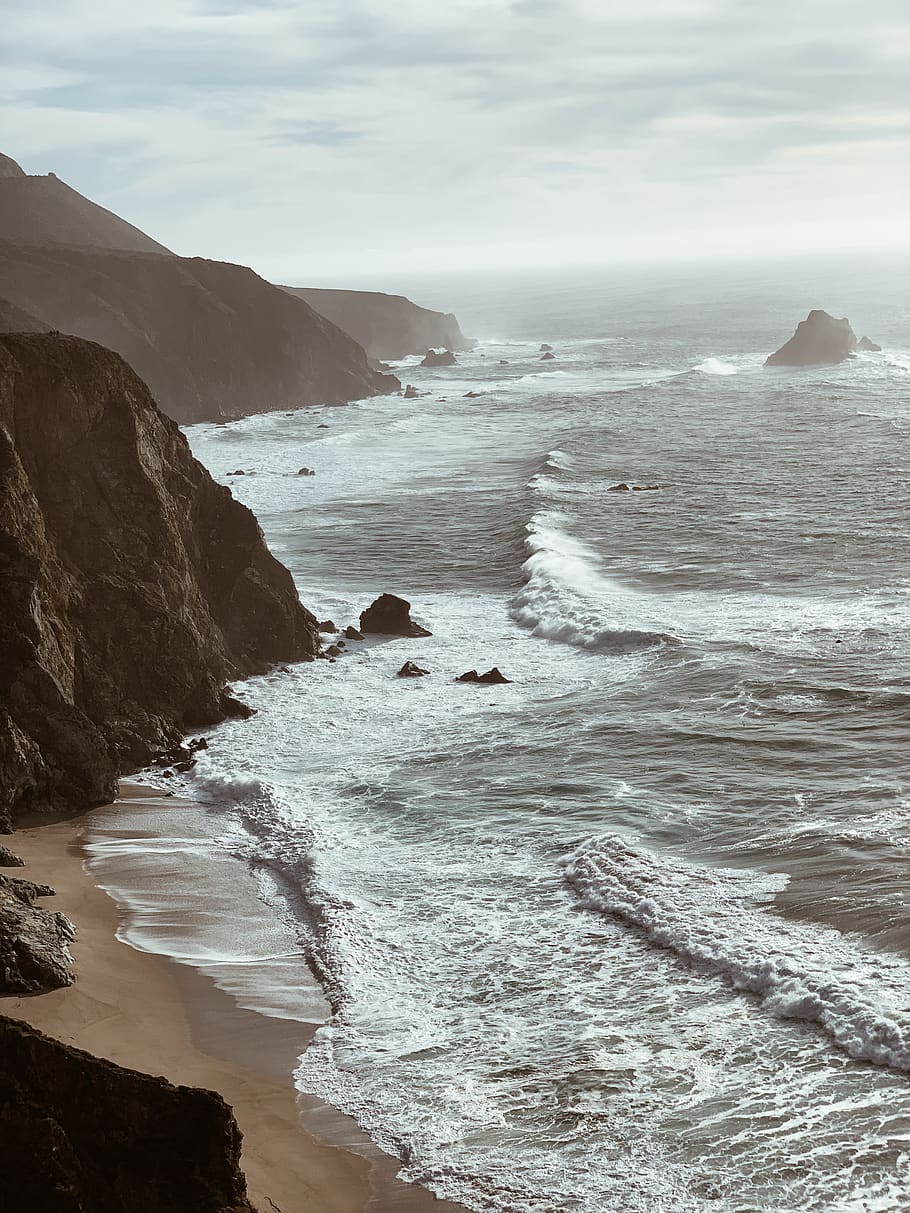 ocean wave beside rock formation, promontory, nature, outdoors HD wallpaper