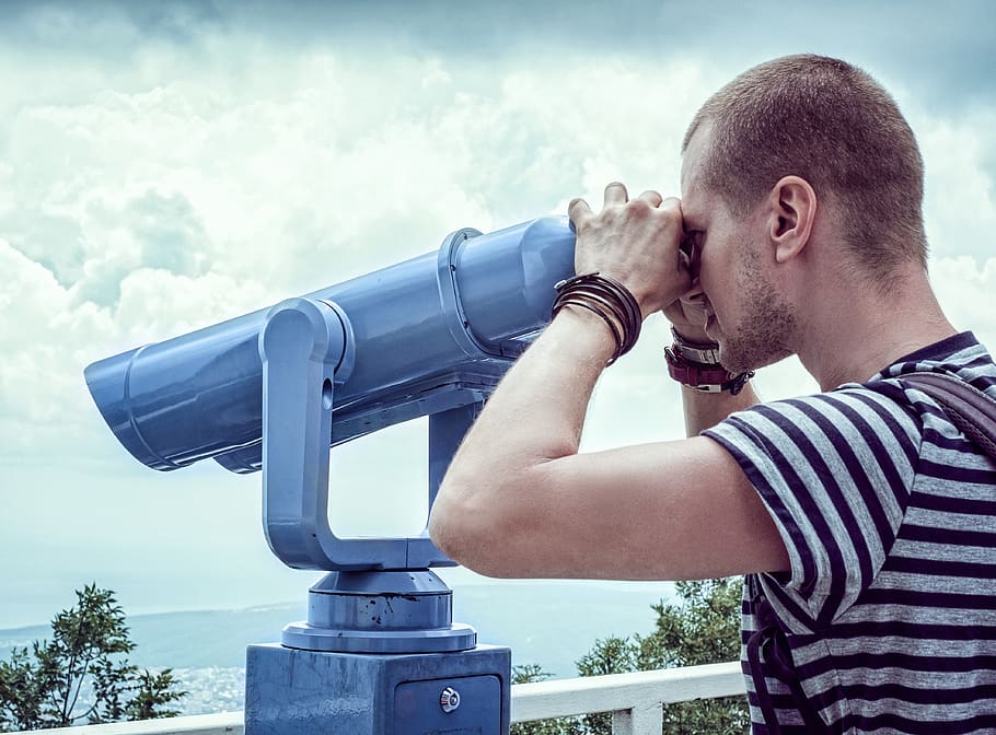 Person in White and Gray Stripes Crew Neck T Shit Using Telescope Near White Metal Handrails Under White Clouds during Daytime HD wallpaper