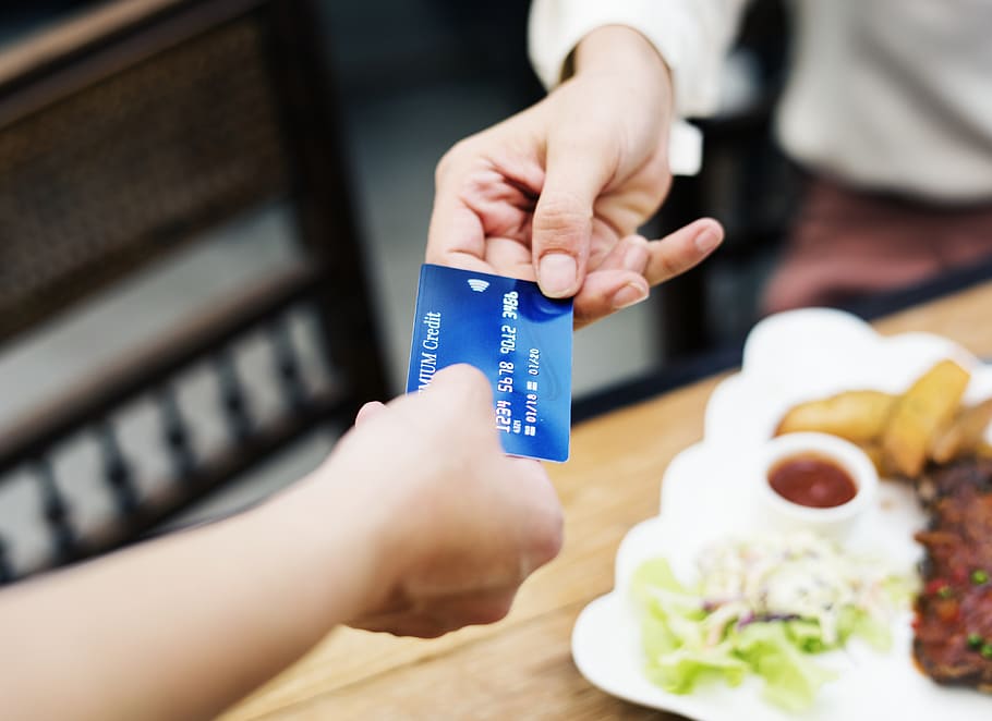 Two Person Holding Credit Card Closeup Photo, banking, cuisine