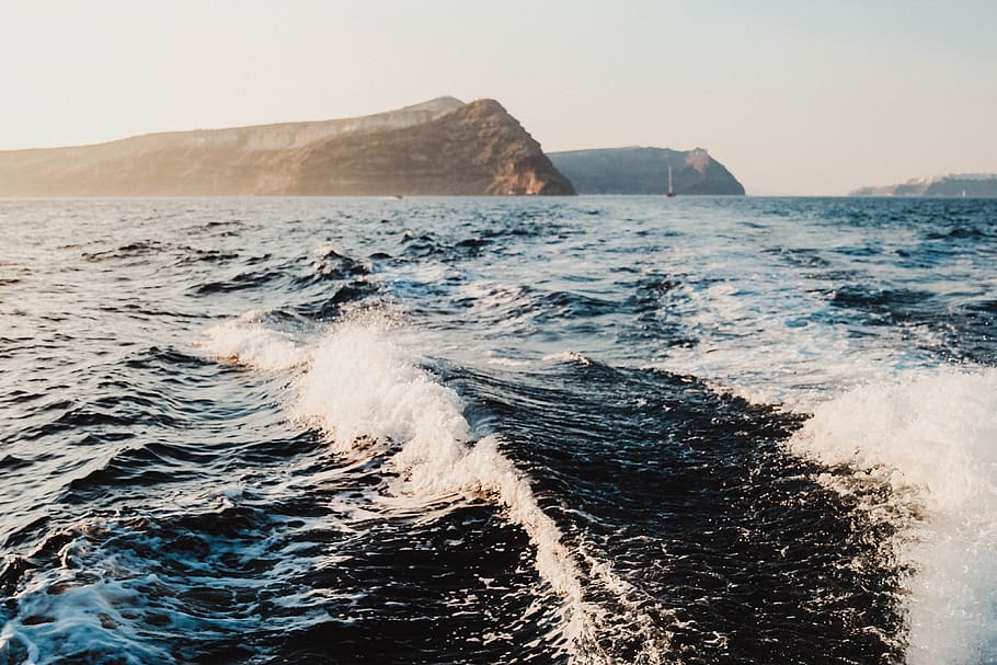body of water in distance of mountain, cliff, wave, shore, coast HD wallpaper
