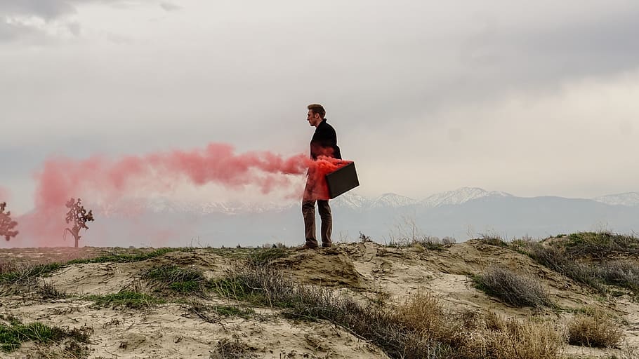 Red smoke coming out of a man's briefcase., united states, lancaster, HD wallpaper