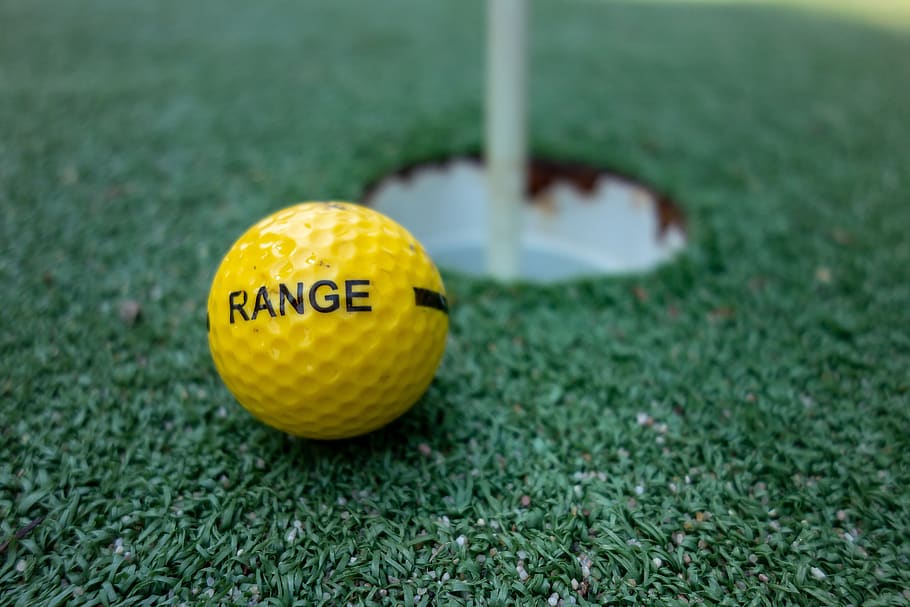 ball, hole, golf, green, putting, sport, yellow, grass, close-up HD wallpaper