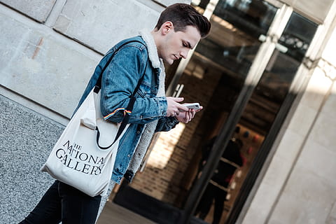 walking man using smartphone, person, human, bag, pants, clothing HD wallpaper