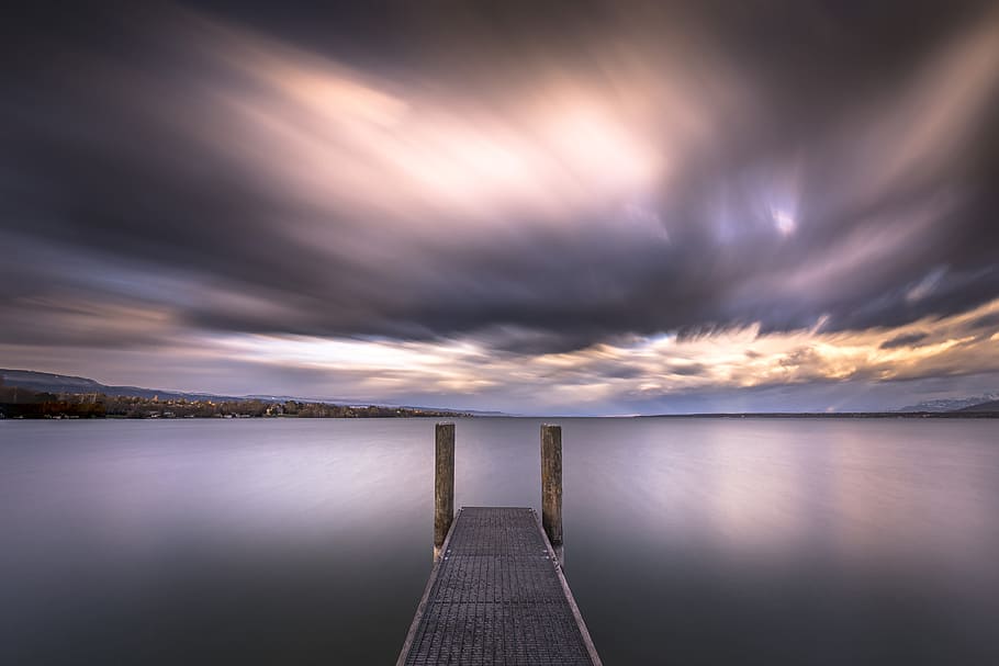 brown wooden dock near body of water, long exposure, cloud, sky