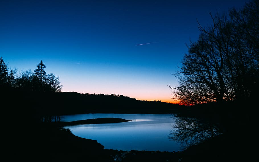 Silhouette of Trees Near Body of Water, clouds, dark, dawn, evening HD wallpaper