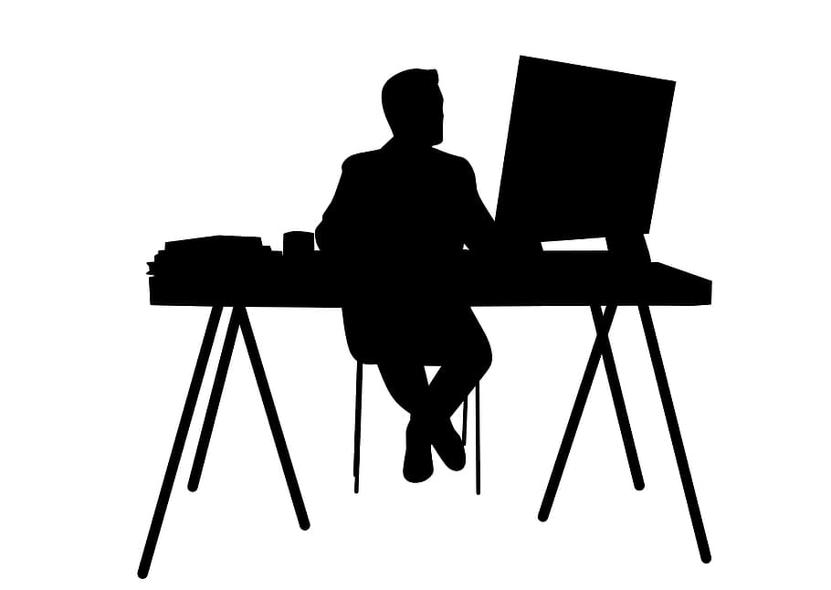 Black silhouette on white background of office worker at workstation.
