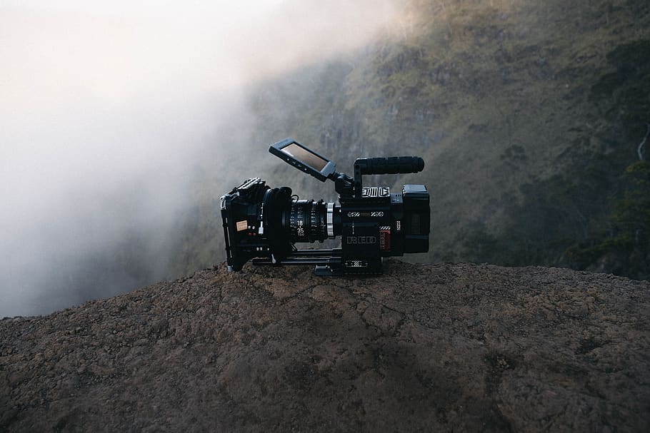 black video camera on rock, machinery, transportation, environment HD wallpaper