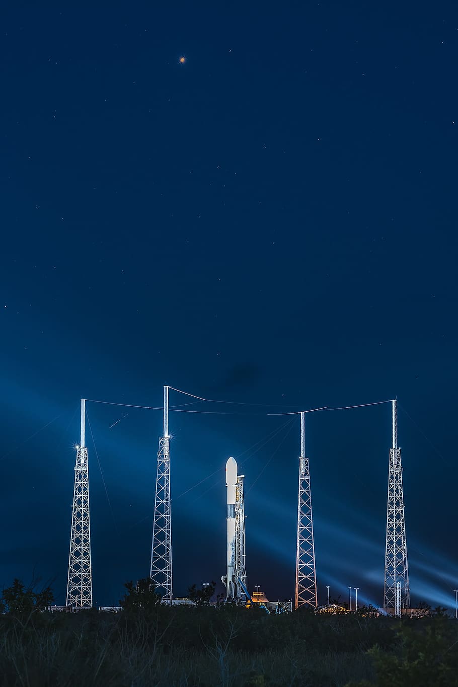 five curtain buildings at night, launch, mission, rocket, spacex