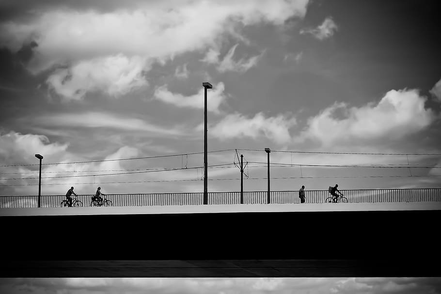 People Riding on Bicycle during Daytime, architecture, black-and-white HD wallpaper
