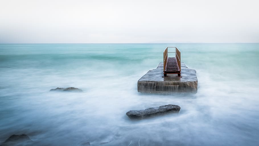 Brown Stone on Water, beach, dawn, dock, fog, foggy, horizon HD wallpaper