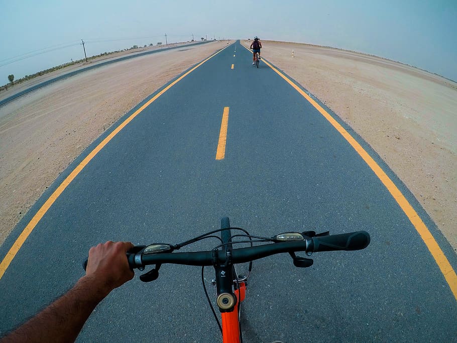 Person Riding Bicycle, asphalt, bicycles, cyclists, daytime, electric posts HD wallpaper