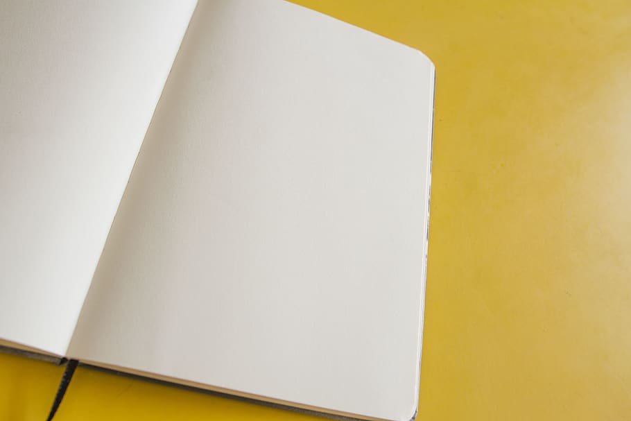 White Book Page on Yellow Surface, background, blank, blank page