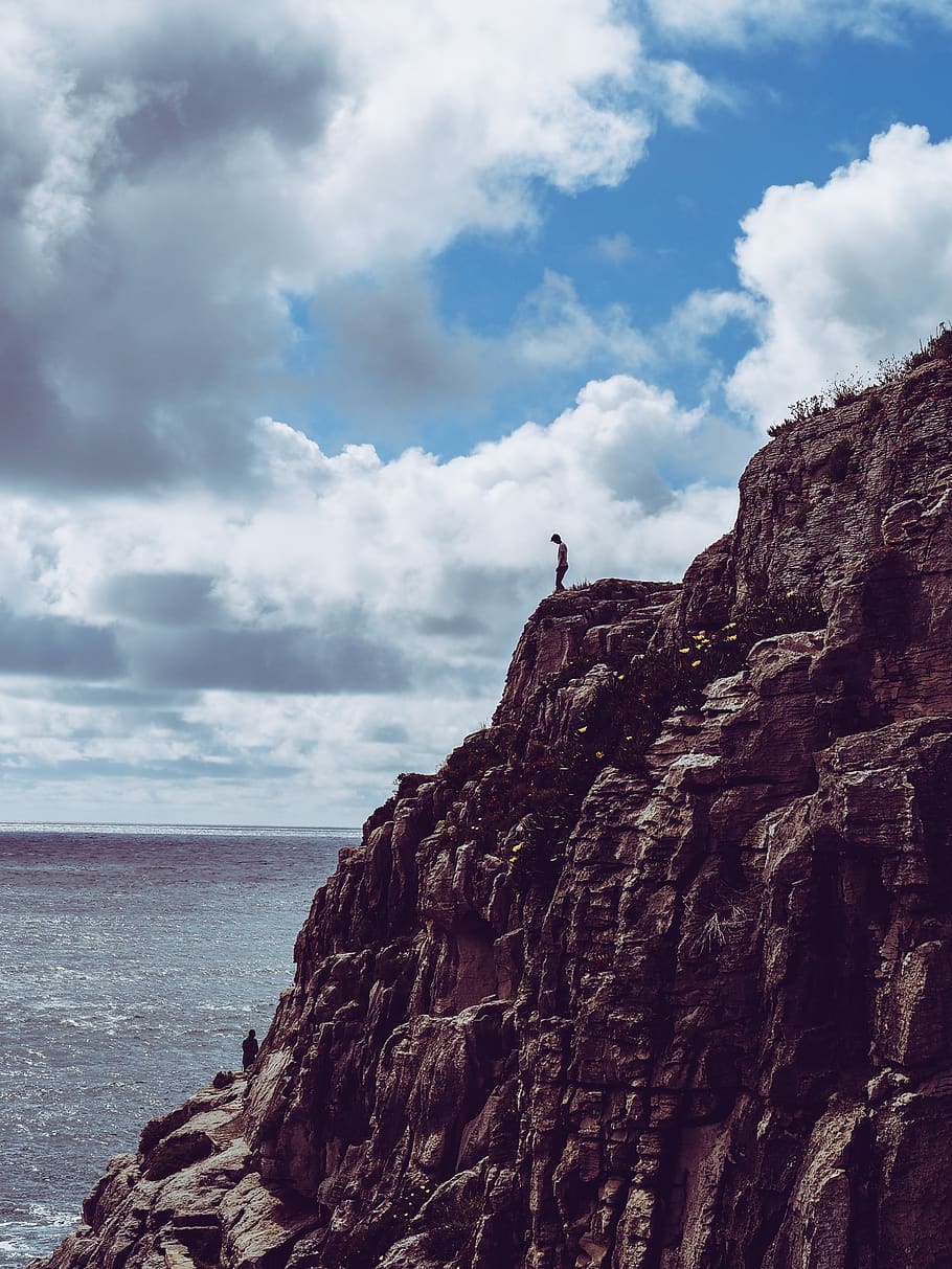 Person Standing On Cliff, clouds, daylight, europe, Lisbon, ocean HD wallpaper