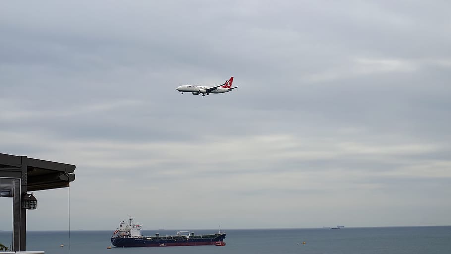 White Plane Flying Above Black Ship, aircraft, airplane, clouds HD wallpaper