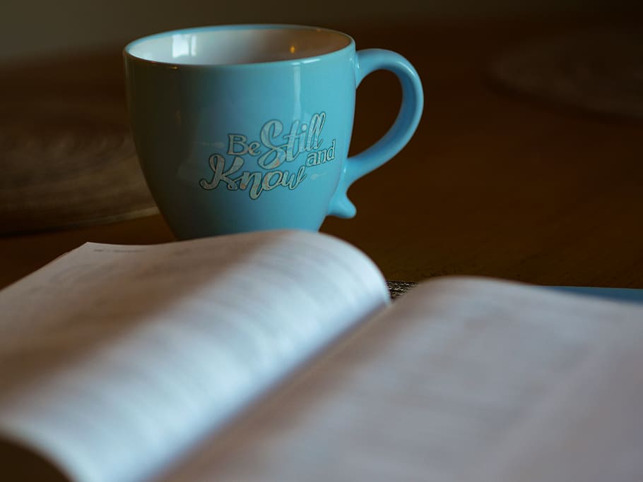 shallow focus photography of open book beside blue ceramic cup, HD wallpaper
