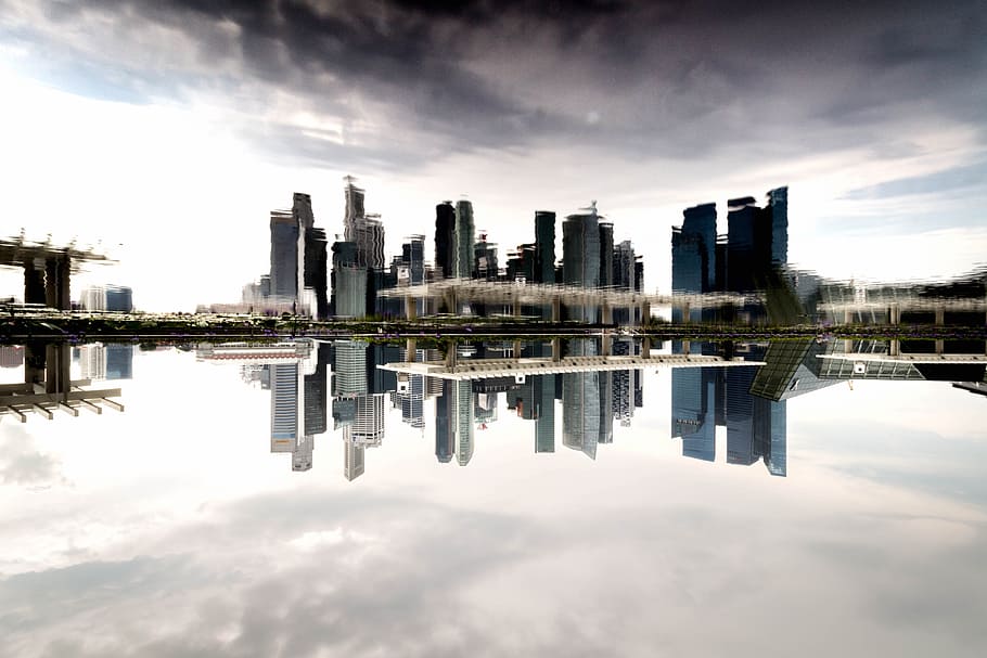 landscape photography of high-rise building near body of water HD wallpaper
