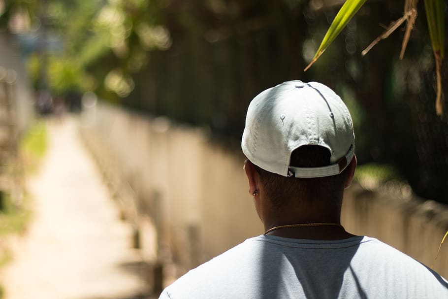 Selective Focus Photography Of Man Wearing A Hat, boy, cap, daylight HD wallpaper