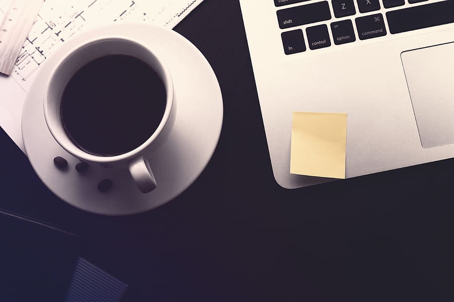 Work desk. Coffee, documents and laptop, cup, mug, note, adhesive note HD wallpaper