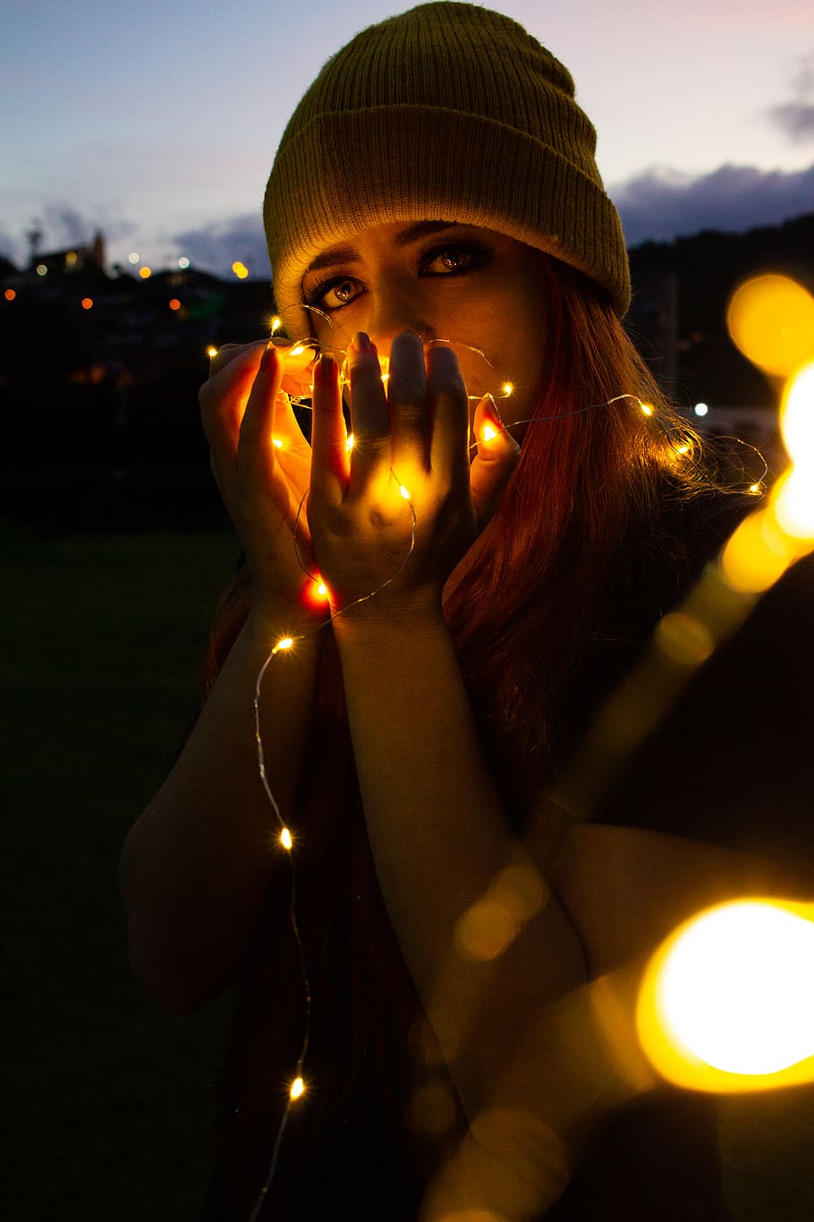 Woman Holding String Lights, evening, standing, one person, looking at camera HD wallpaper