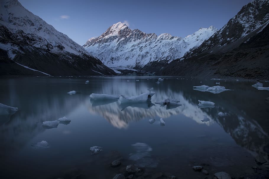 snow capped mountain near body of water during daytime, calm HD wallpaper