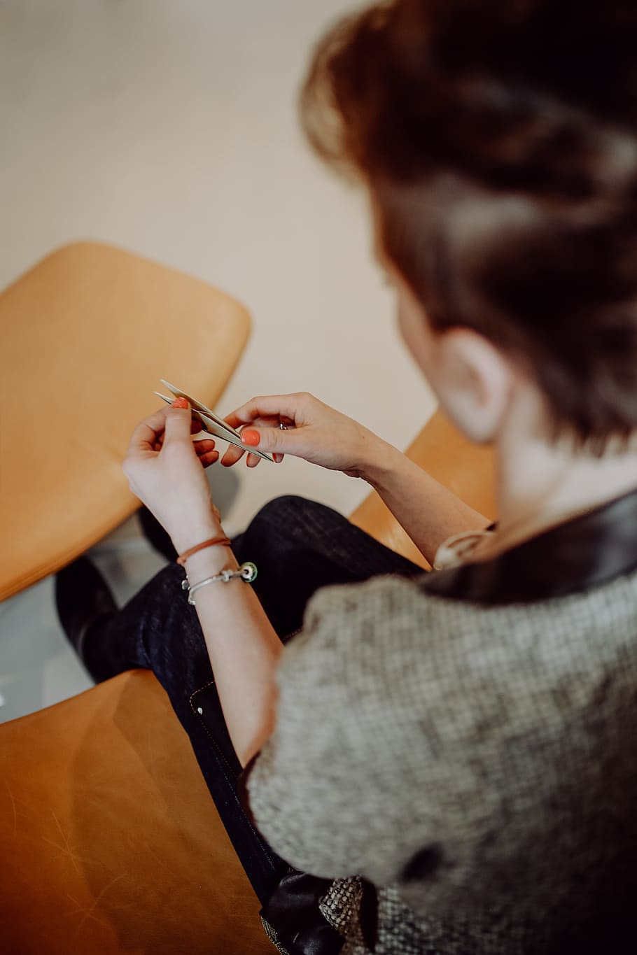 Women folding sheet of paper while making origami, creative, workshop HD wallpaper