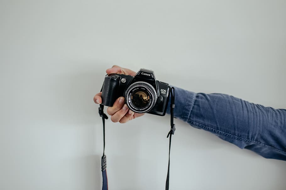 person holding black camera, camera - photographic equipment HD wallpaper