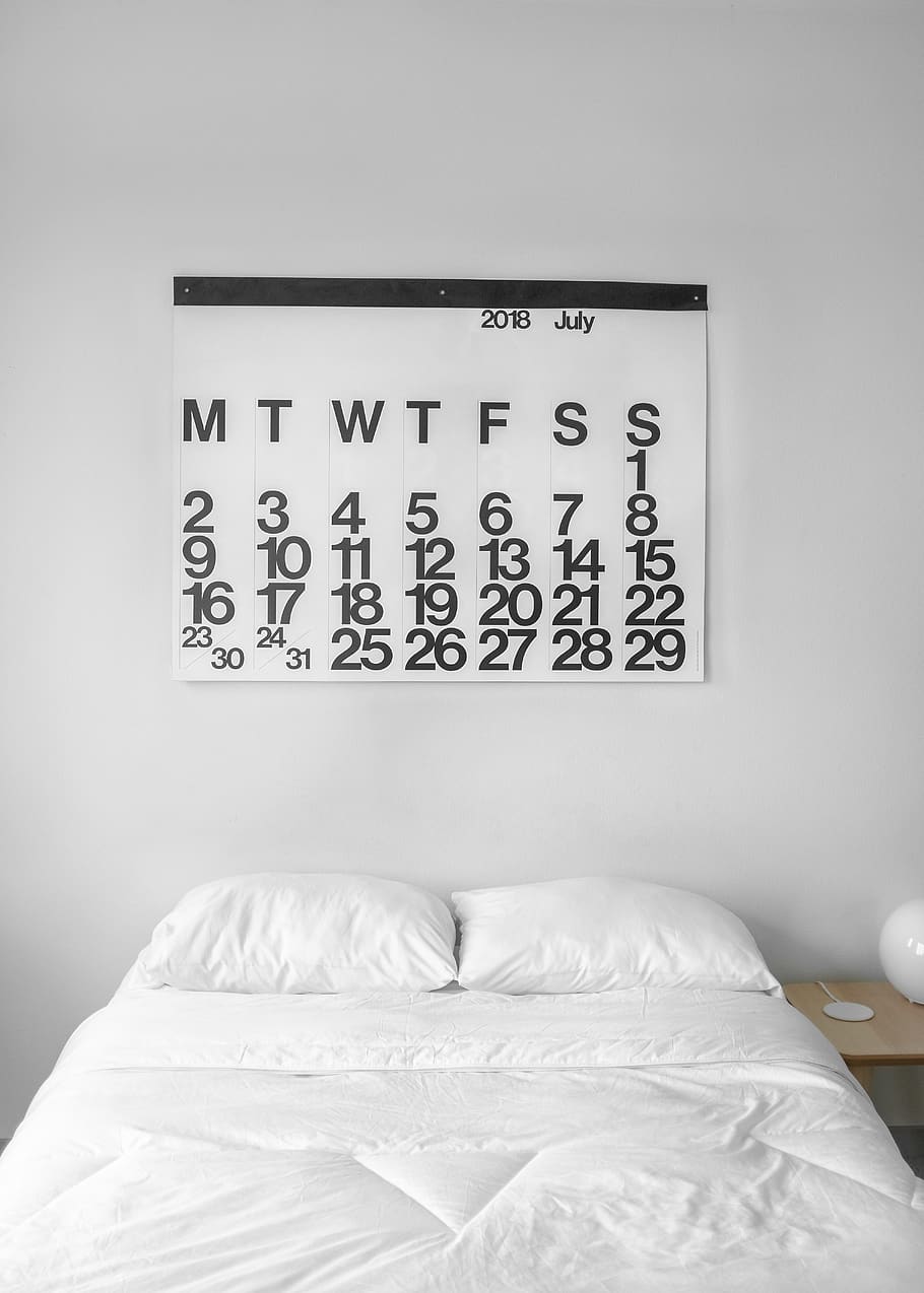white 2018 July calendar on the wall, bed, bedroom, furniture