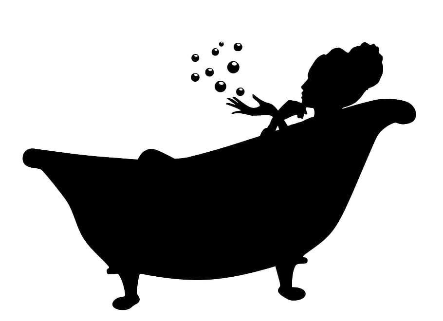 Silhouette of woman lounging in bathtub, enjoying bubbles., women