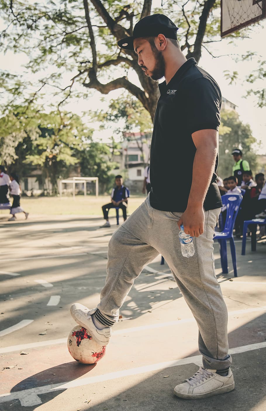 Man Playing Soccer, ball, daytime, pavement, person, wear, incidental people HD wallpaper