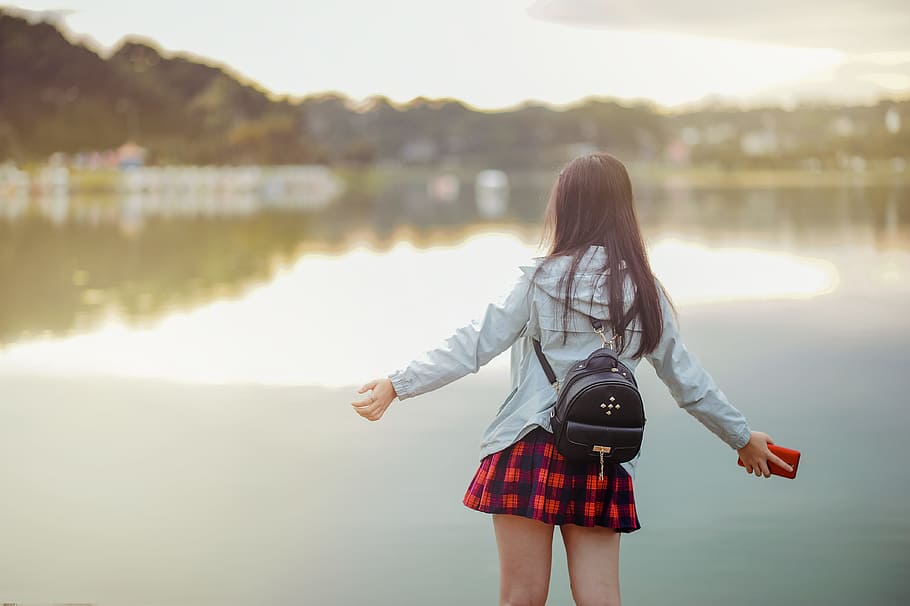 Selective Focus Photography of Girl Near Body of Water, backpack HD wallpaper