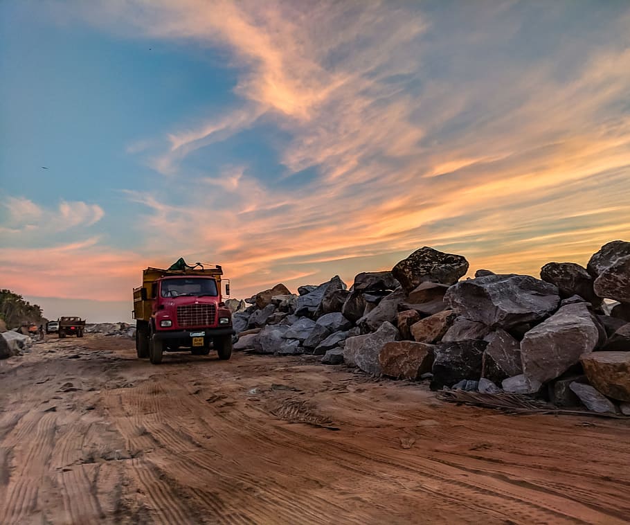 Red Dump Truck Near Filed Rocks Under Cloudy Sky, dawn, dusk, HD wallpaper