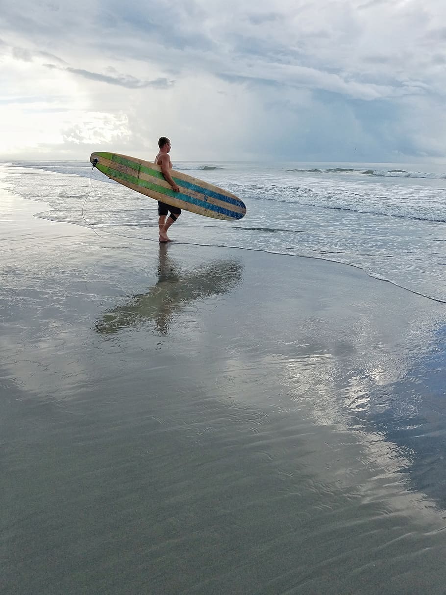 Man Holding Surfboard While Staring At The Ocean, beach, fun HD wallpaper