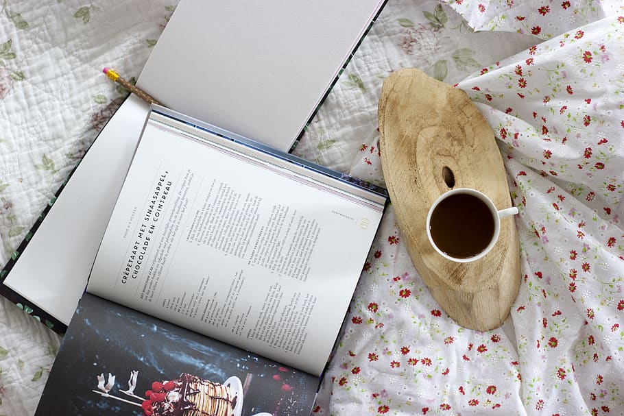 white ceramic mug beside opened book, high angle view, paper HD wallpaper