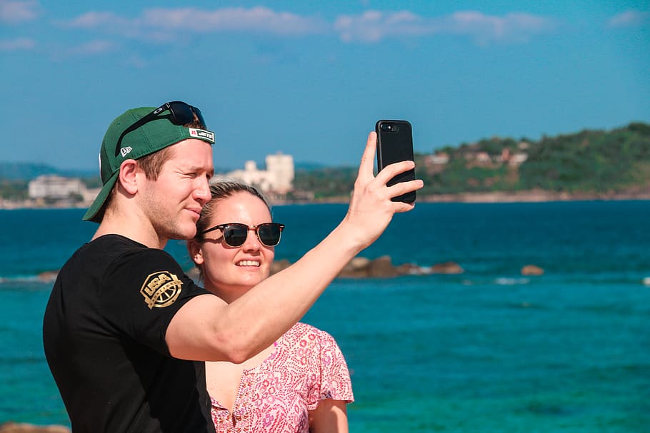 blue sky, cap, cellphone, love, couple, daytime, fashion, girl HD wallpaper